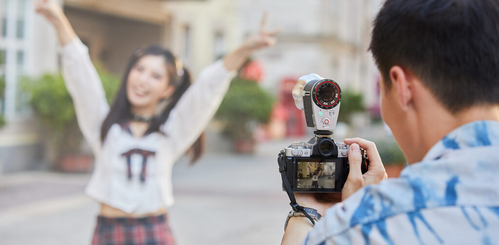 Teenagers doing a photoshoot using Godox Lux Cadet Retro Flash
