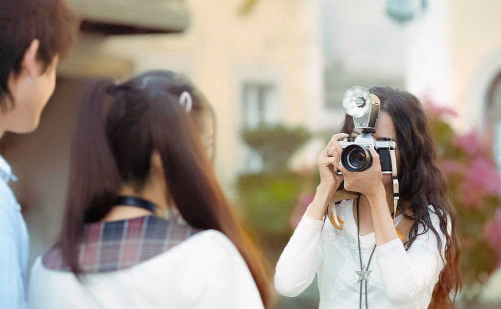 Teenagers doing a photoshoot using Godox Lux Cadet Retro Flash