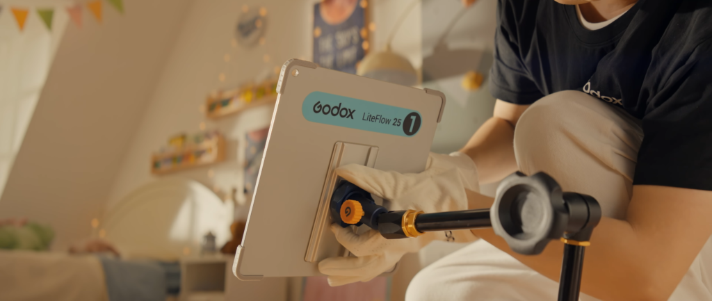 gaffer setting up Godox LiteFlow 25 D1 on a movie set