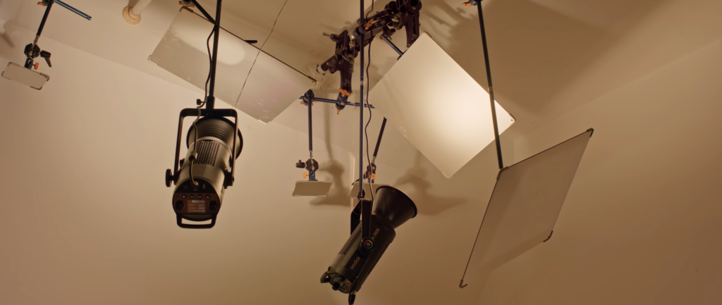 Godox lighting setup rigged near the ceiling video lights with LiteFlow cine reflectors