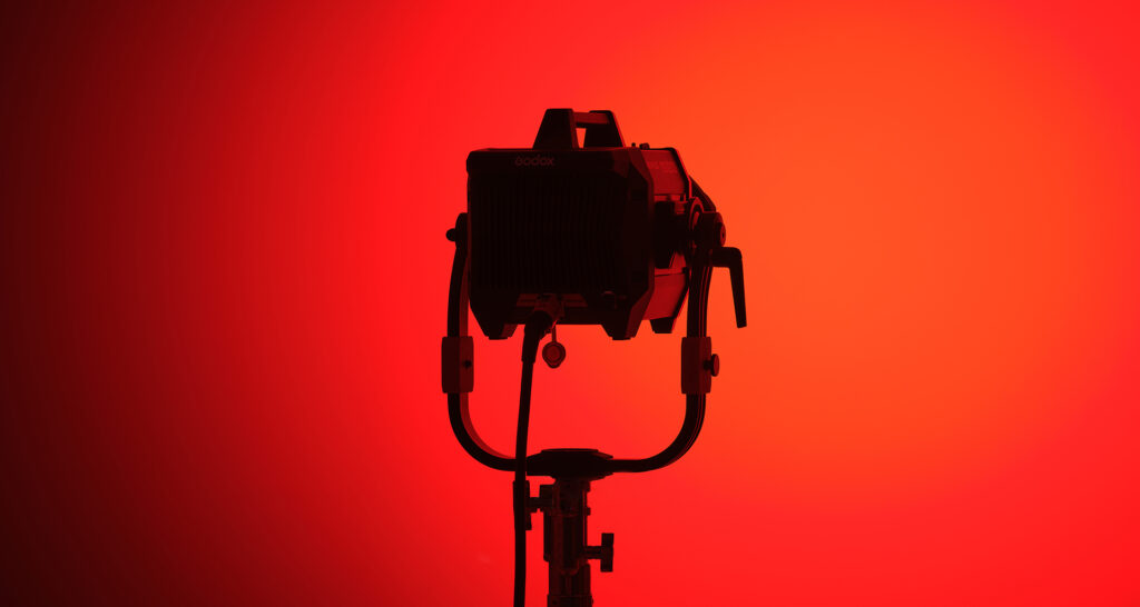 Godox KNOWLED MG1200R professional production full-color RGB COB LED light on red background
