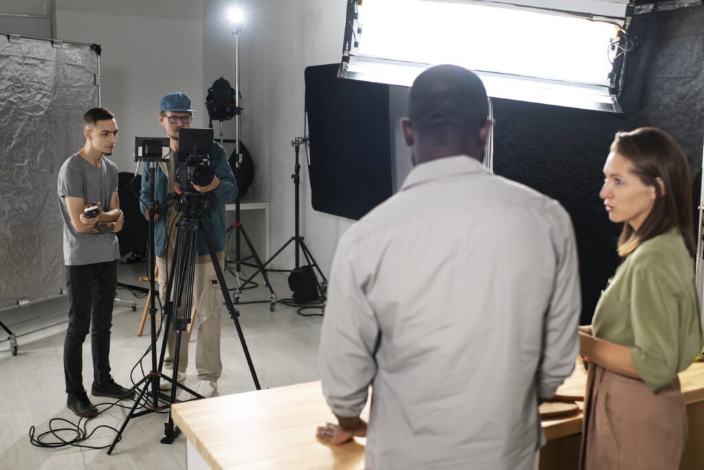 Cameraman and assistant recording a tv programme 