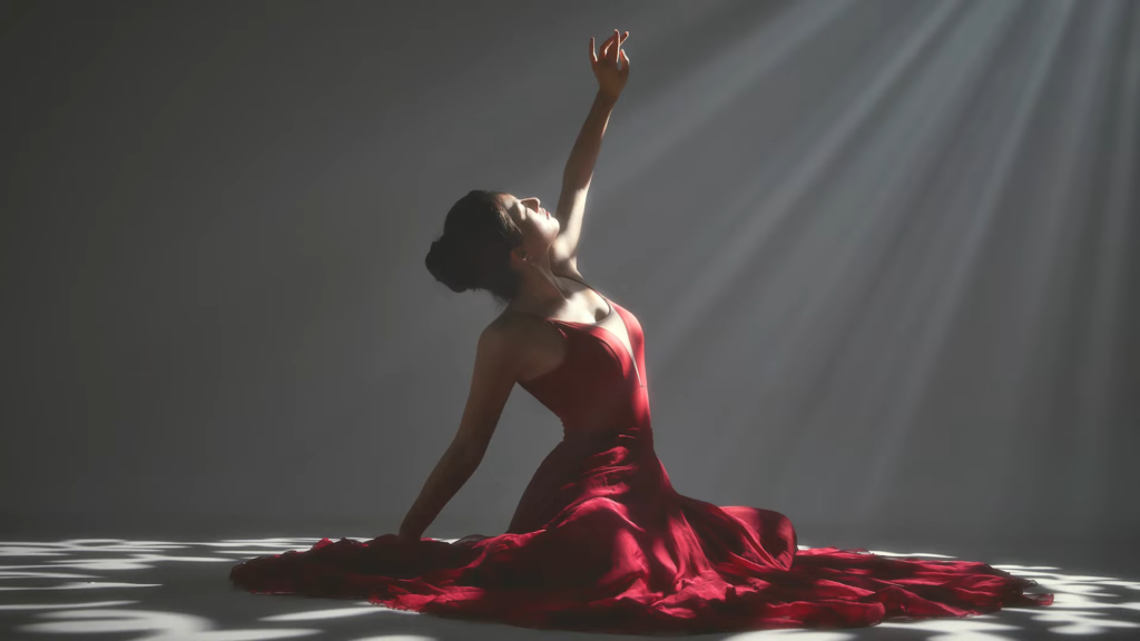 Dancer in a red dress in photography studio lit by Godox BFP Flash Projection Attachment 