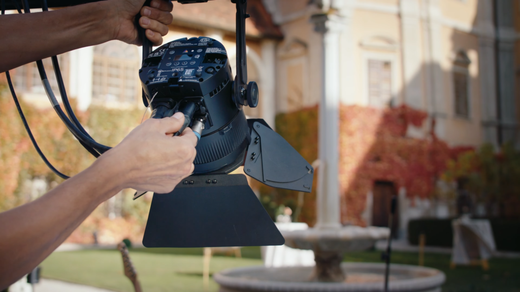 Astera QuikSpot RGBMA LED Fresnel Spotlight for Event Video Production with barn doors wired operation on set