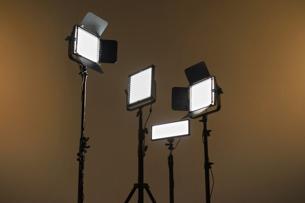 Multiple LED panel lights displayed in a studio on light stands